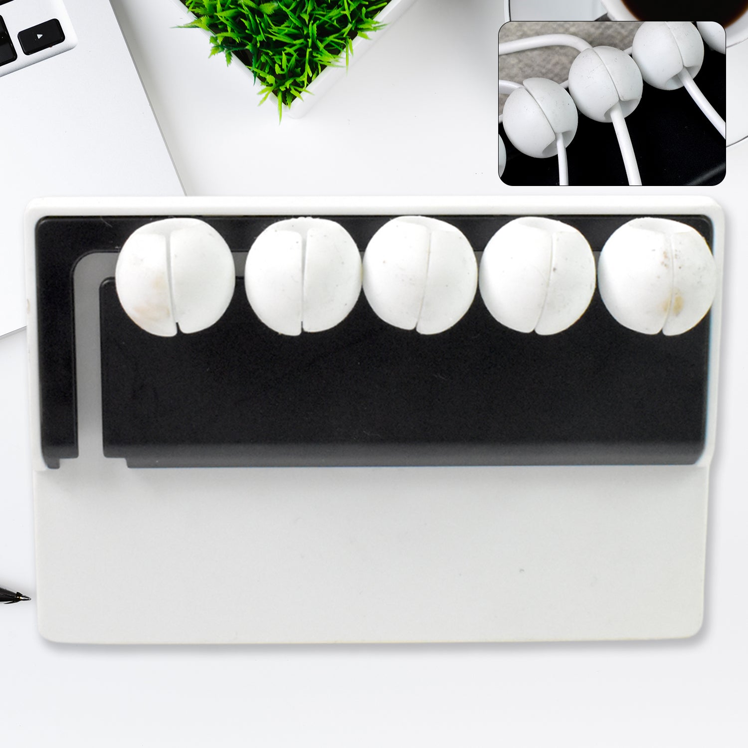 5-slot adhesive cable holder organizing wires on a desk