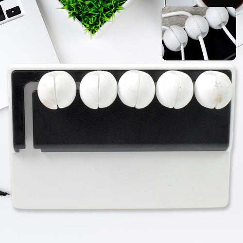 5-slot adhesive cable holder organizing wires on a desk