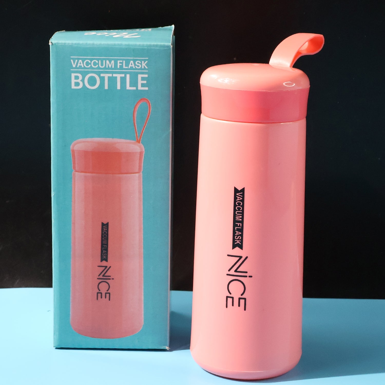 Pink plastic water bottle with carry strap and leak-proof lid