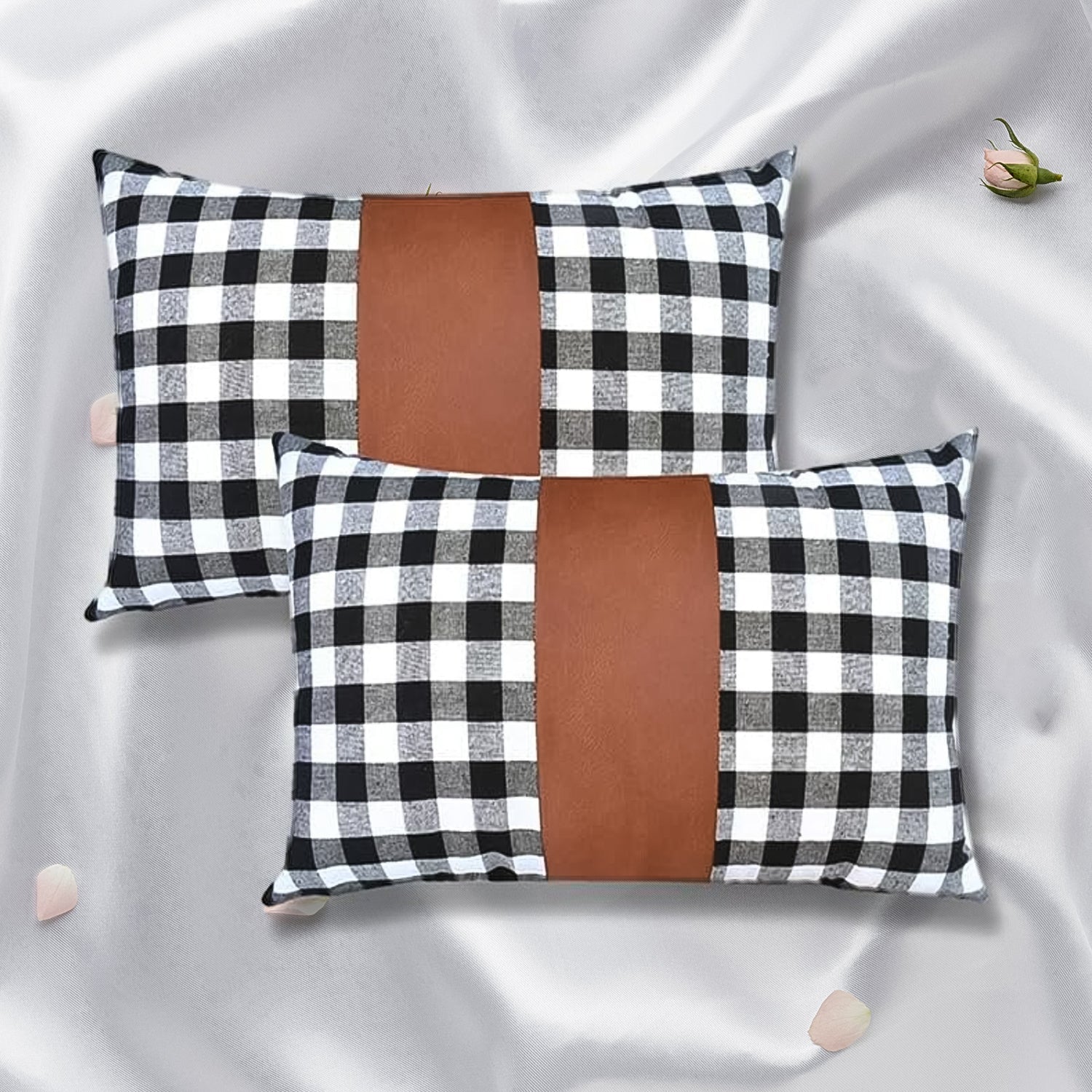 A pair of stylish leather and cotton cushion covers displayed on a modern sofa.