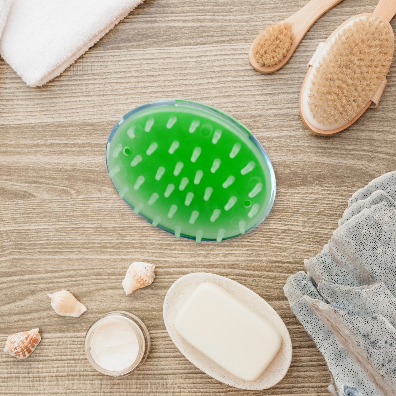 Handheld silicone scalp massager in a vibrant blue color.