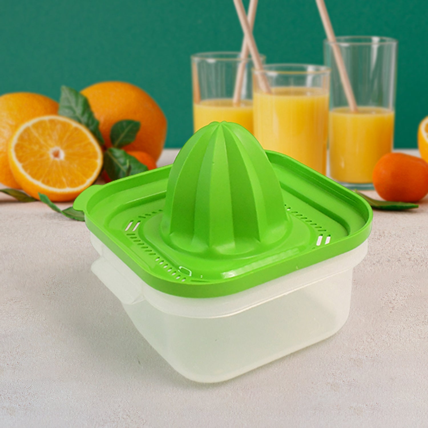 Close-up view of manual orange juicer showing integrated strainer for smooth juice