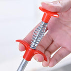 The grabber end of the drain cleaning brush for removing hair and debris.