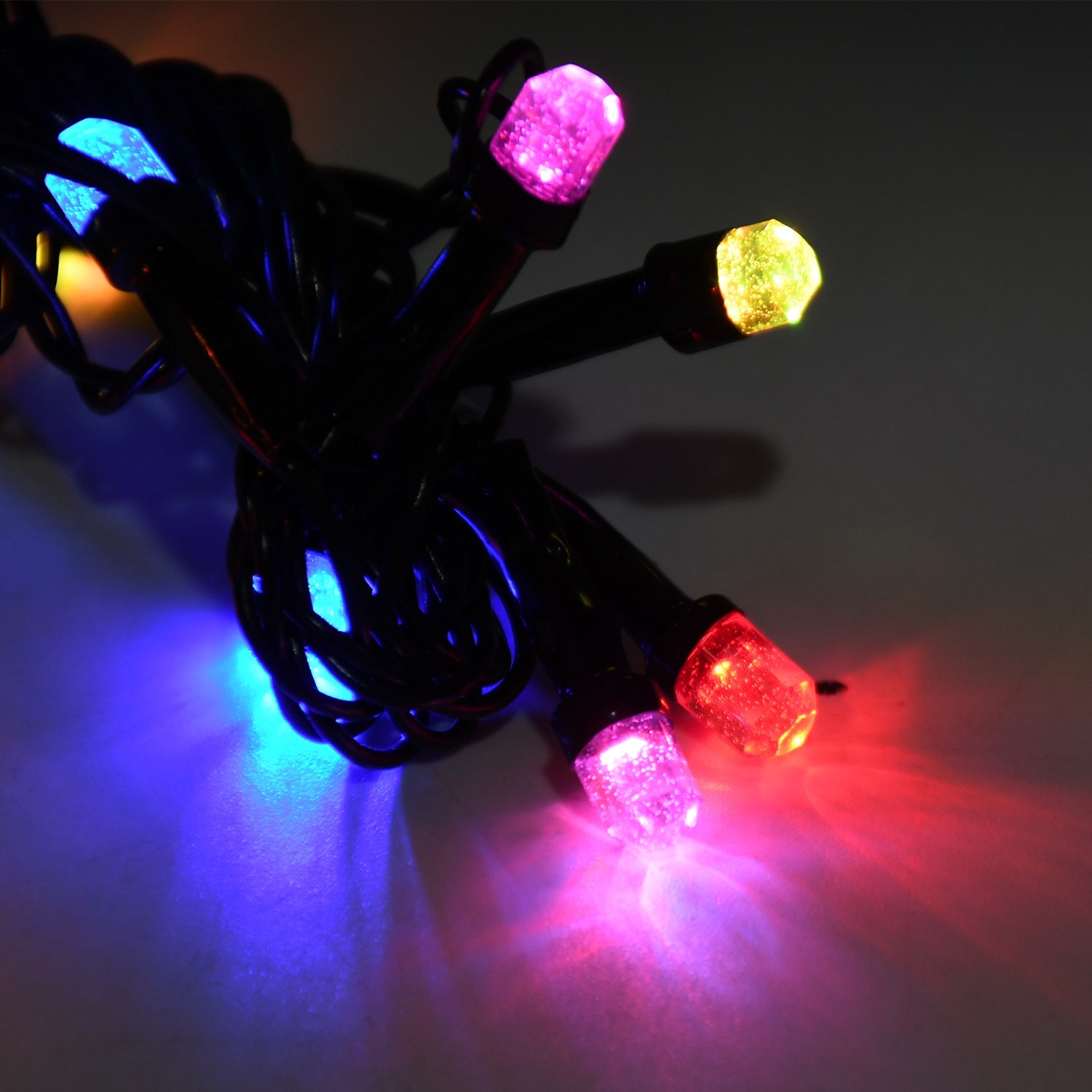 Multi-color LED string lights draped for festive decoration.