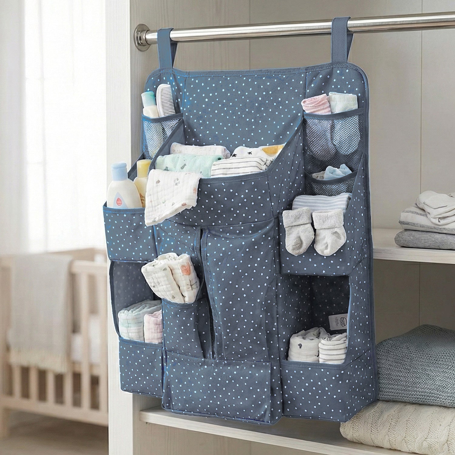 Close-up of storage pockets in baby care organizer for bottles and lotions