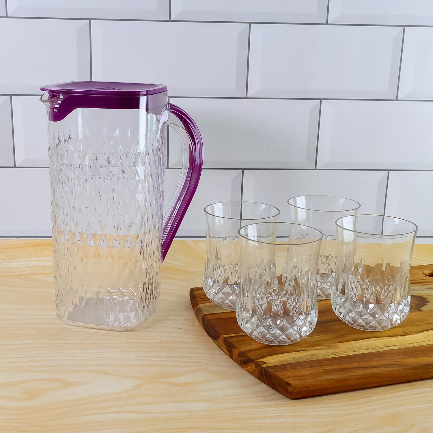 Close-up of diamond-cut texture on plastic jug and glasses