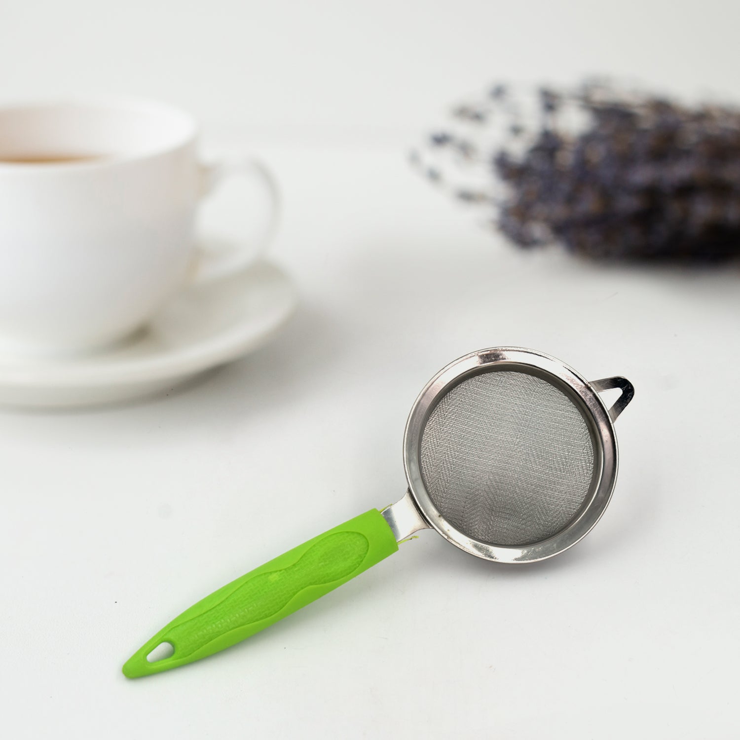 Stainless steel tea and coffee strainer with a sturdy handle.