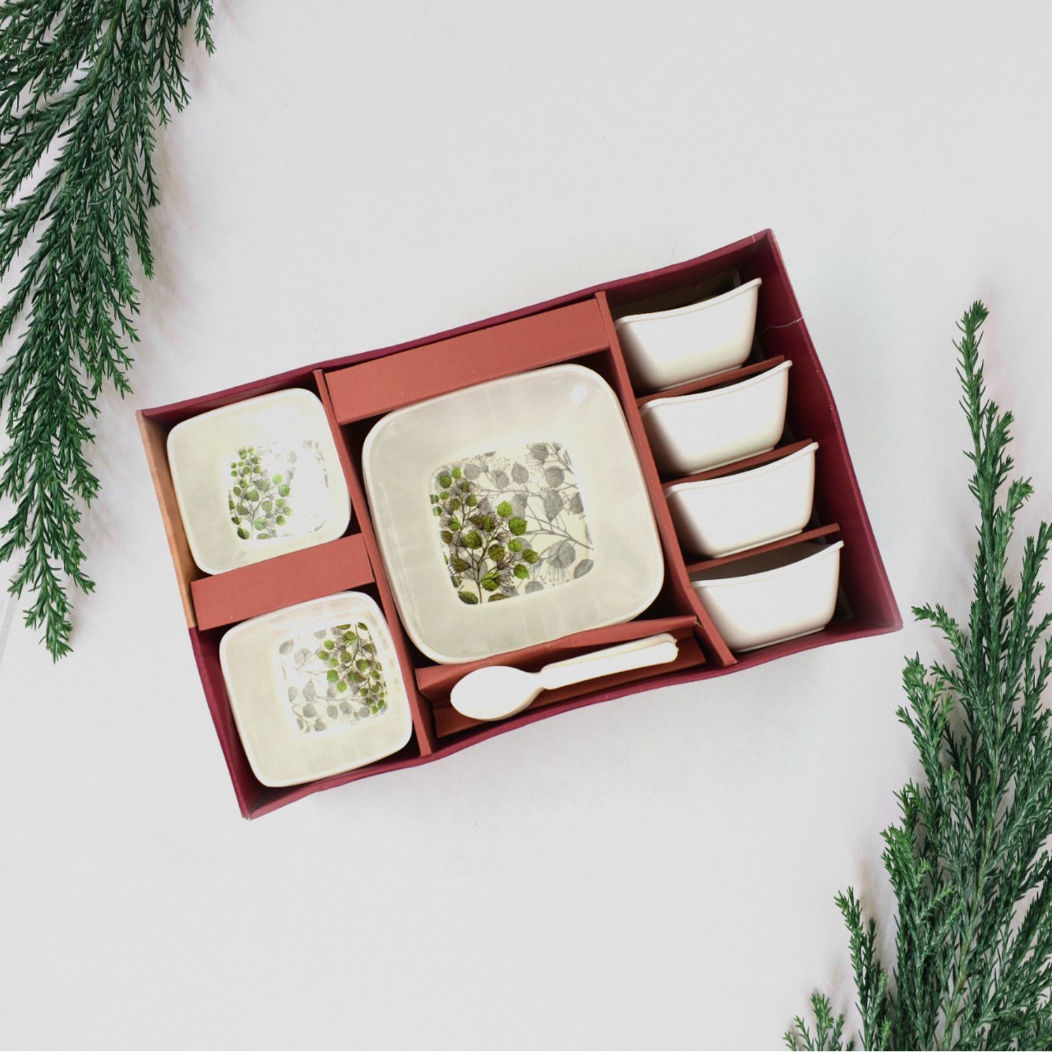 A shiny 13-piece Pudding Serving Set neatly arranged on a white background.