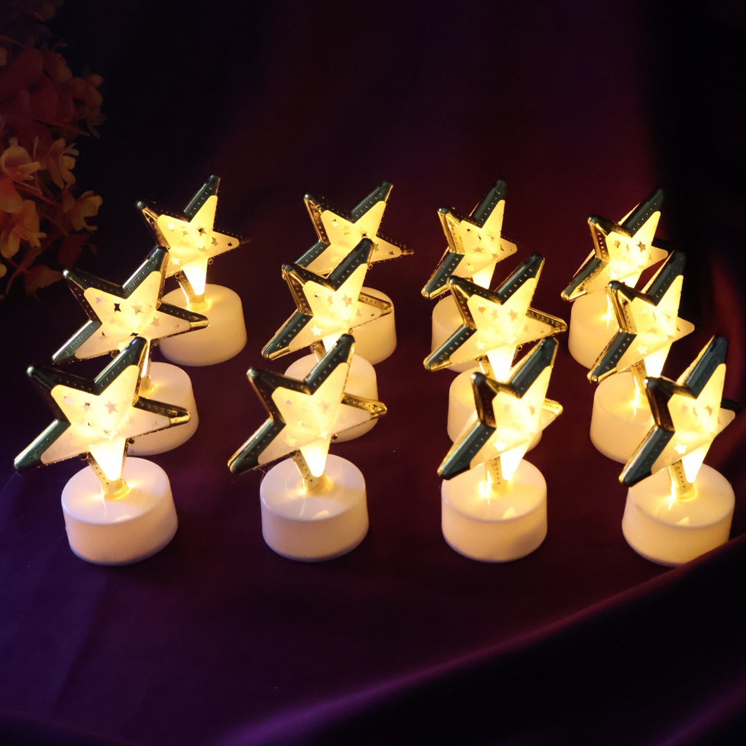 Set of star shaped flameless LED candles with golden outlines for elegant home décor