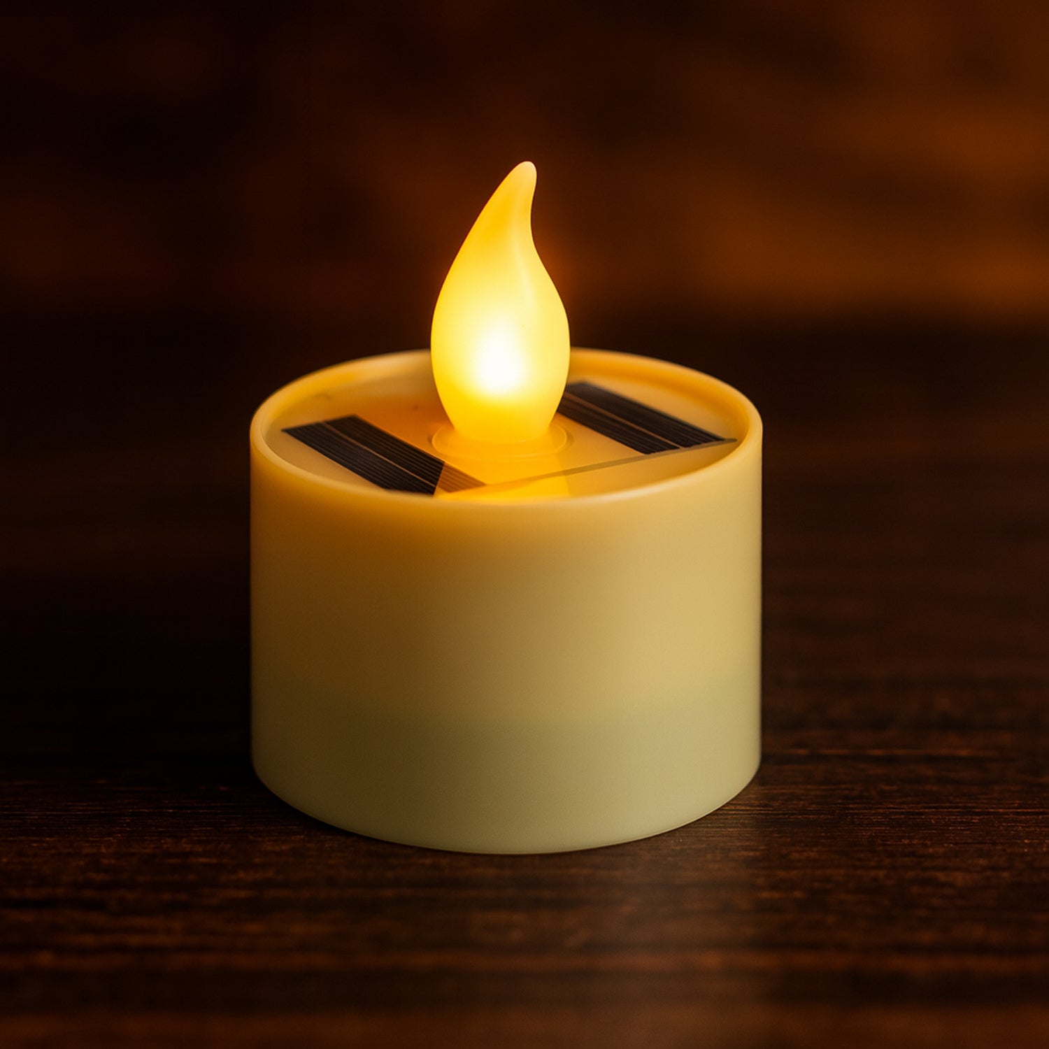 Solar powered LED flameless candle providing warm flickering glow indoors