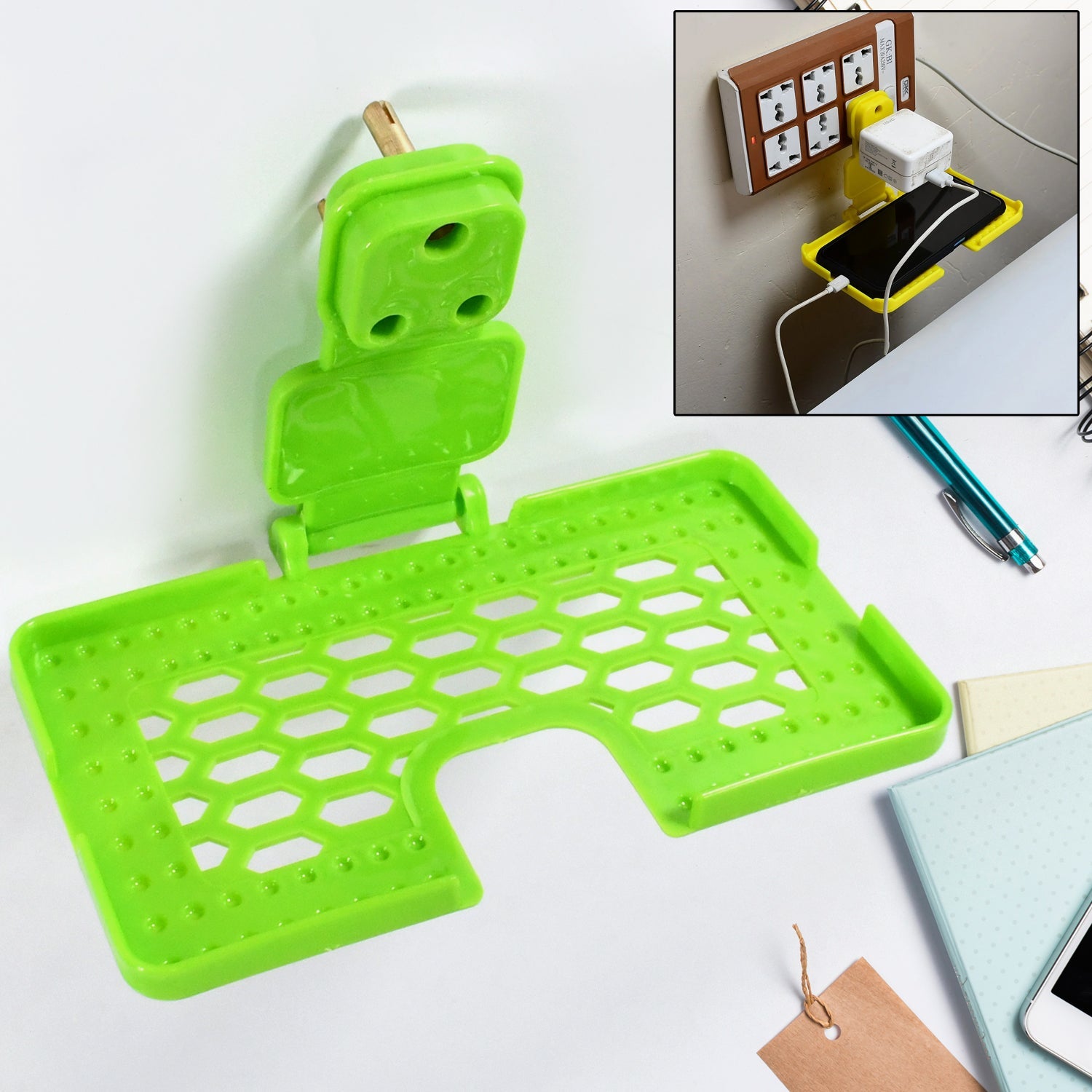 Mobile Charging Holder securely plugged into an Indian wall socket, holding a smartphone.