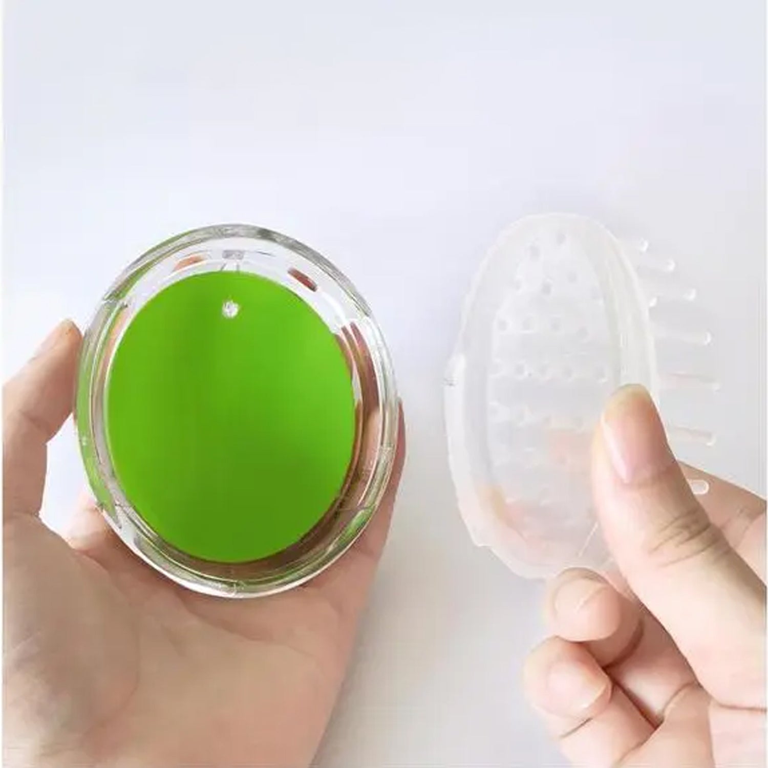 Close-up of the soft silicone bristles on the head massager.