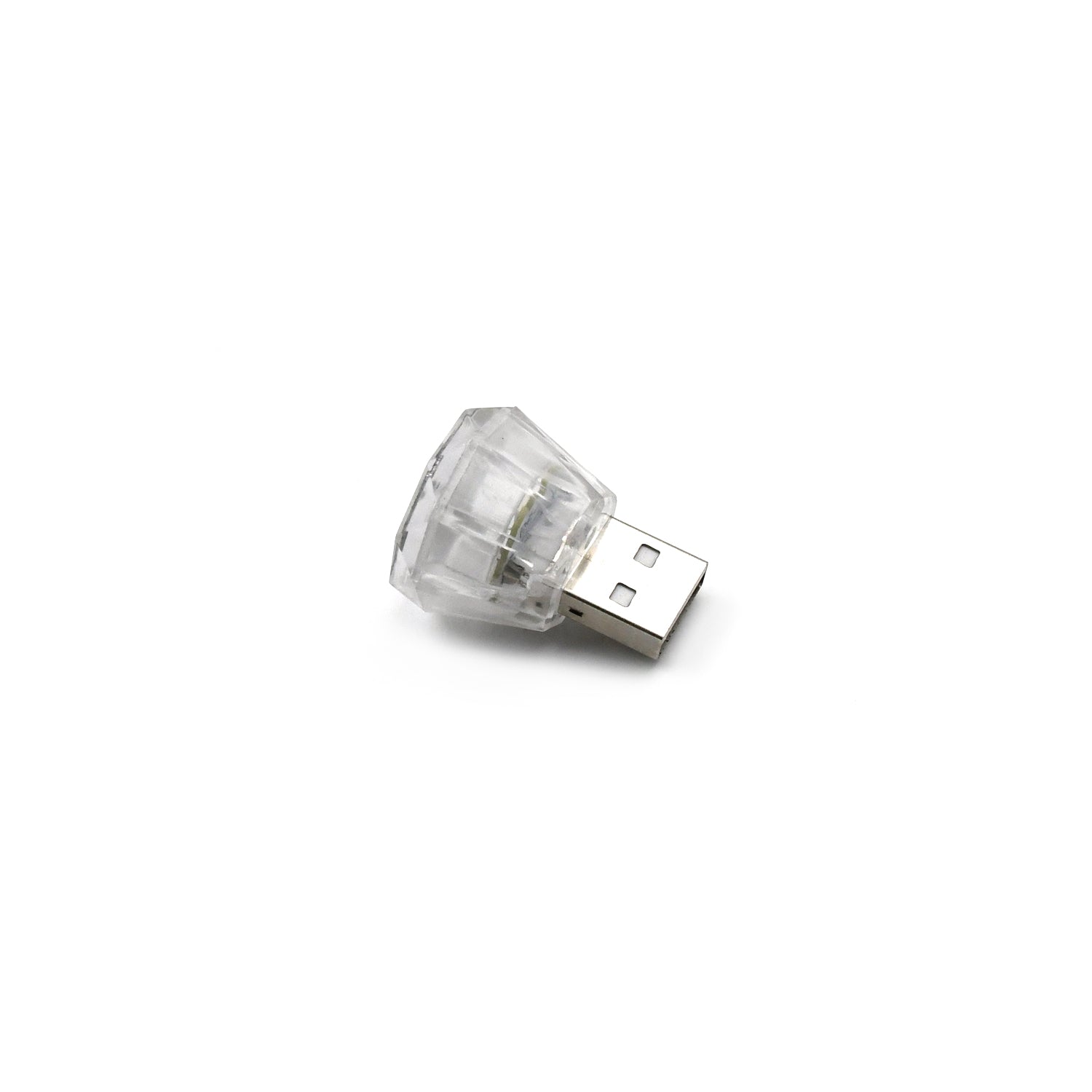 The compact diamond shape USB car interior light displayed on a flat surface.