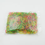 Close-up of 0.75 inch multicolor elastic rubber bands for versatile office and school use.