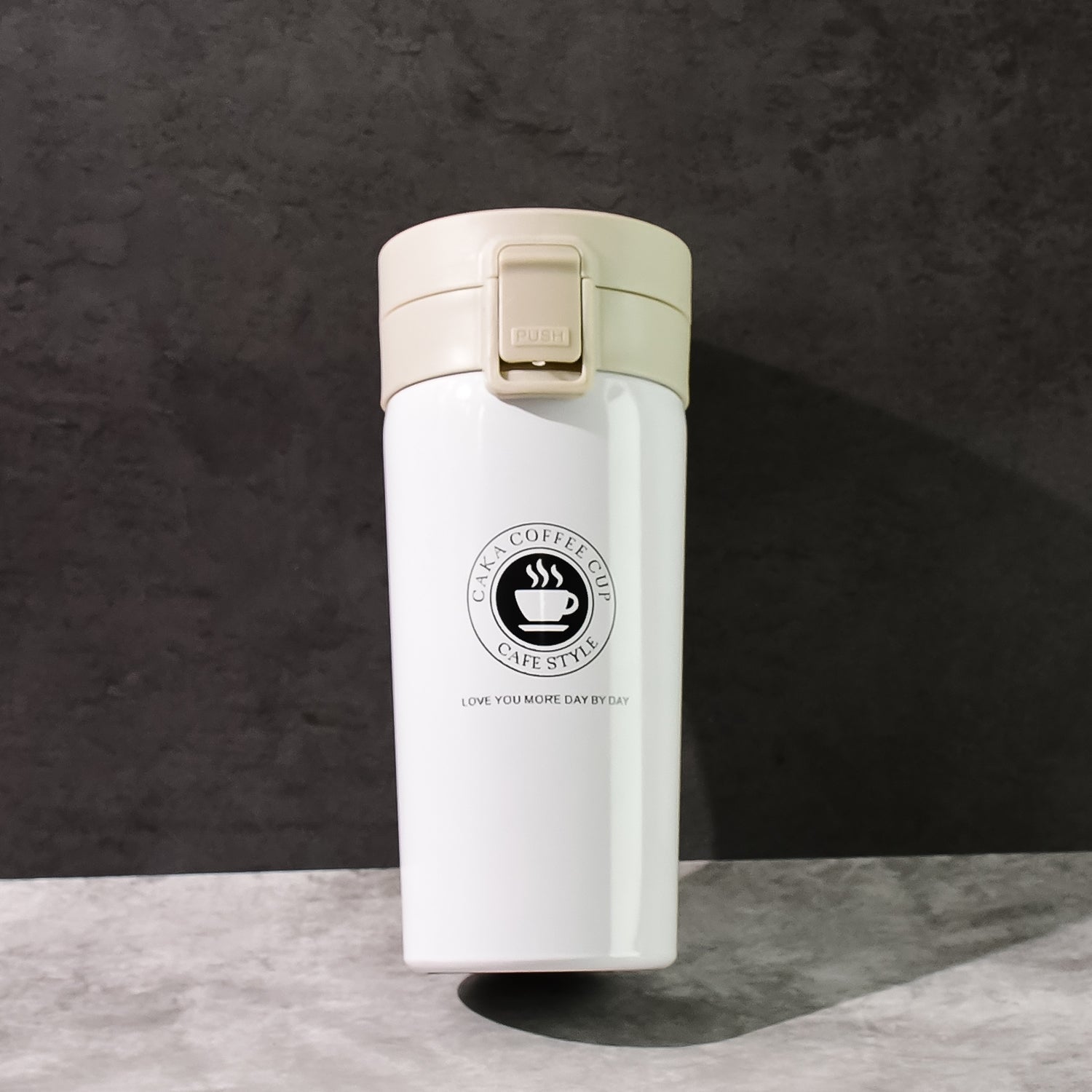 Portable coffee travel flask made of vacuum insulated stainless steel