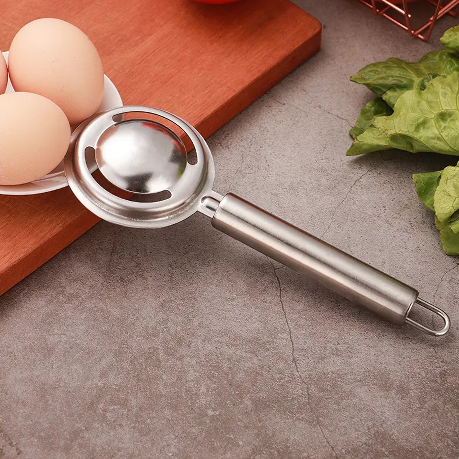 A clean stainless steel egg yolk and white filter, essential for Indian kitchens.