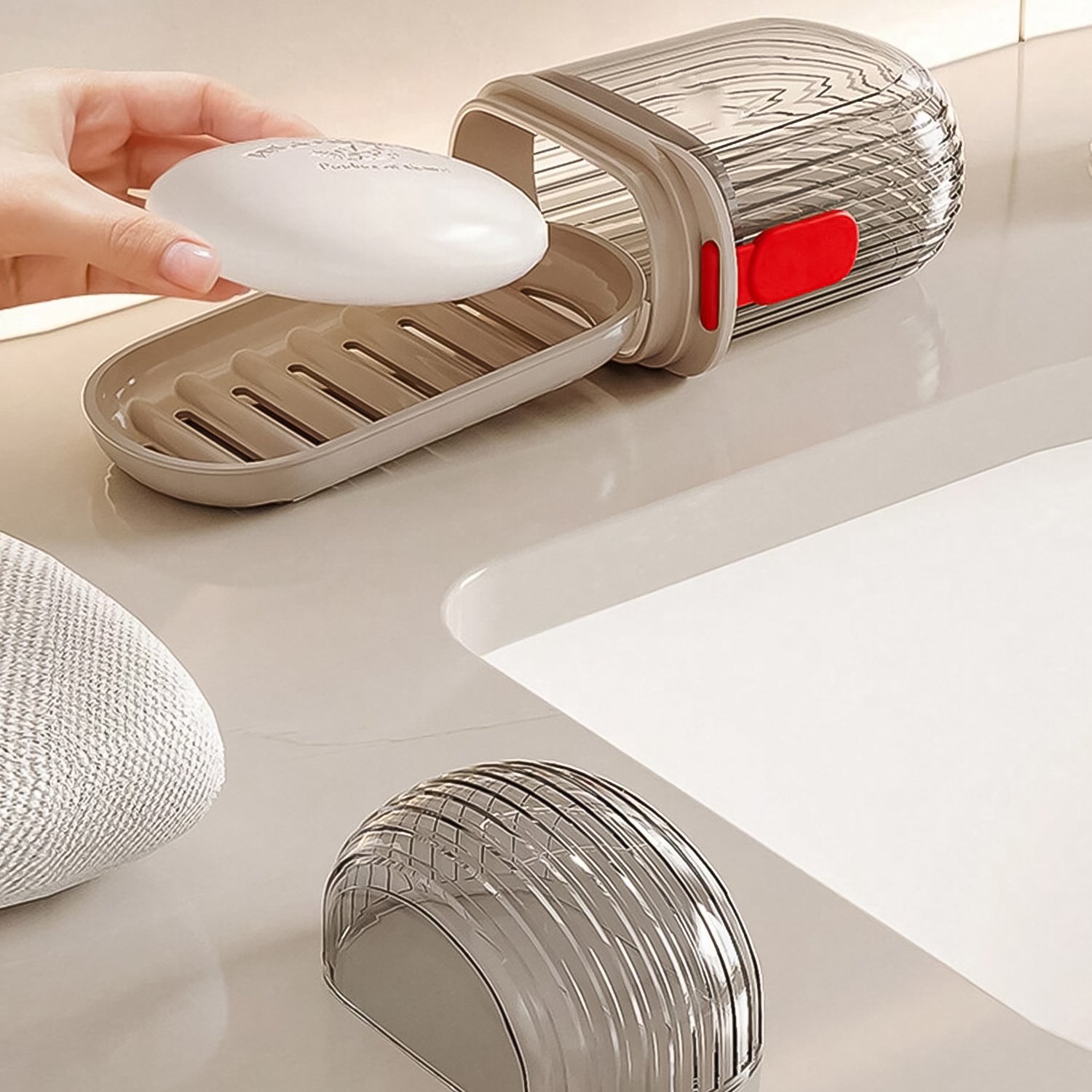 Compact plastic travel soap dish with secure locking lid and drainage.