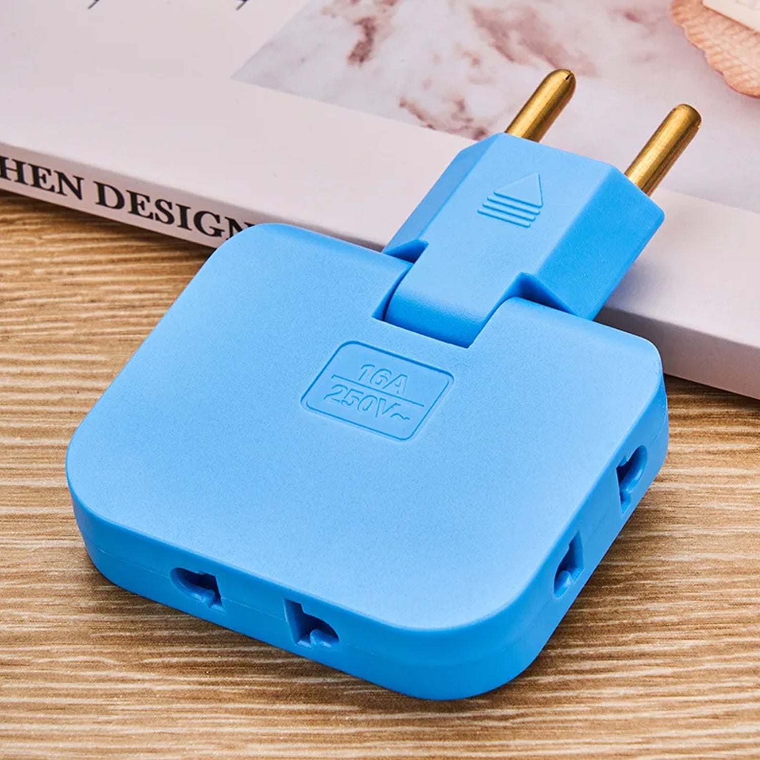 Foldable Wall Plug Adapter powering three devices in a wall socket, demonstrating its multi-outlet capability.