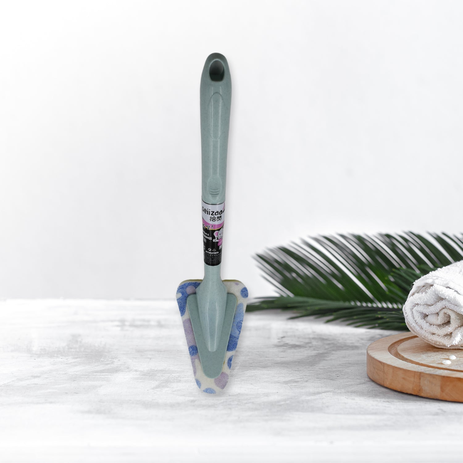 Triangular Sponge Brush effortlessly cleaning a kitchen sink.