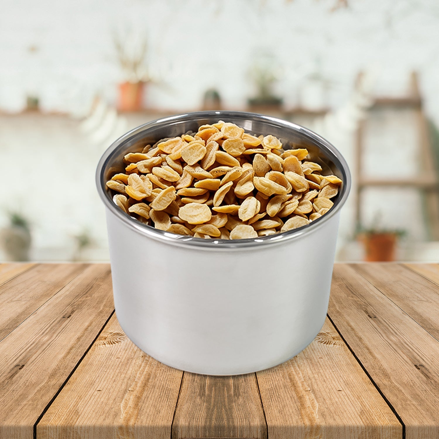 Airtight stainless steel containers filled with coffee beans, tea leaves, and spices, showcasing versatility.