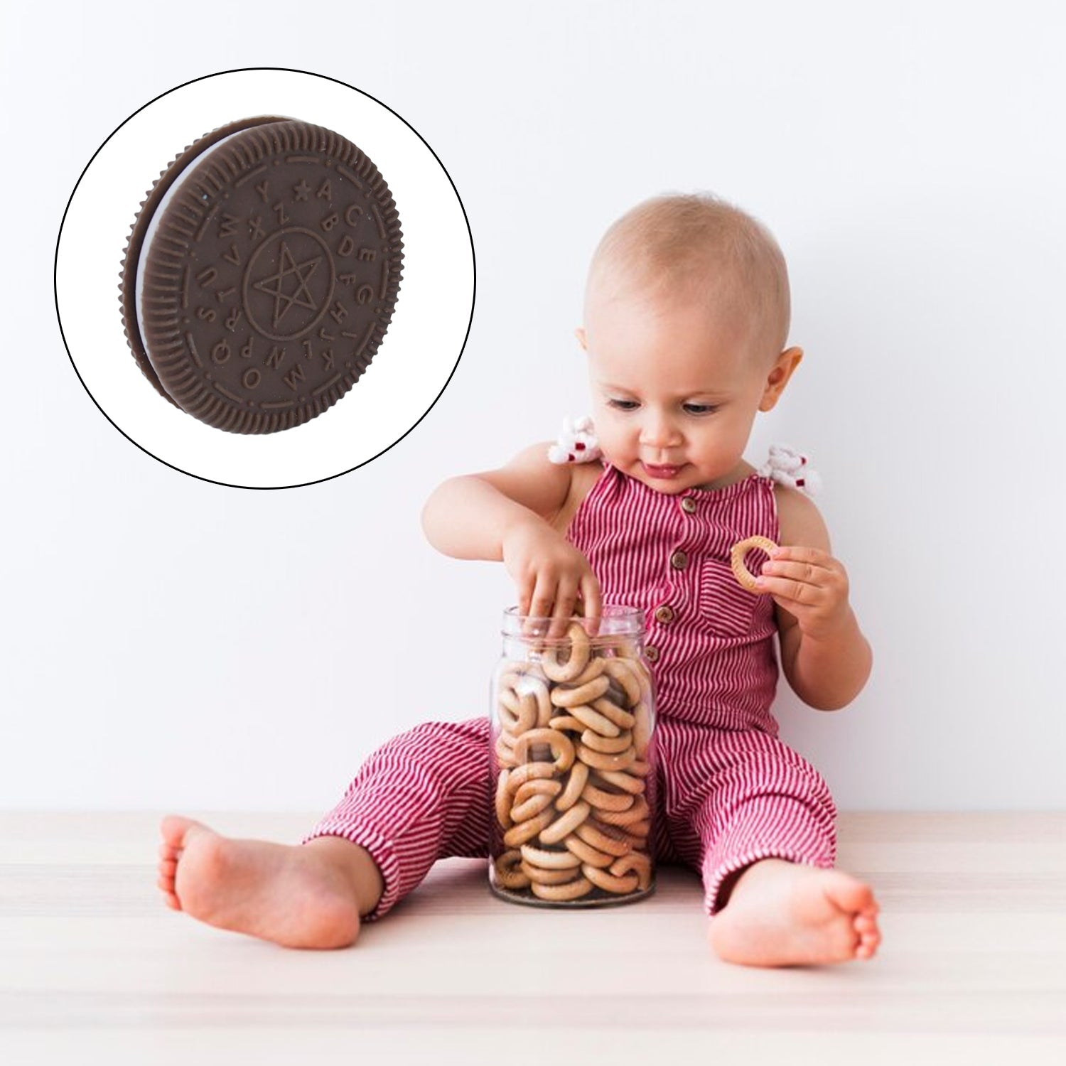 Silicone baby teether named Cushy Teeth with multiple textured chewing areas