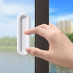 Close up of ergonomic self stick push pull helper installed on flat surface