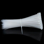 Detail view of the self-locking mechanism on a strong nylon cable tie.