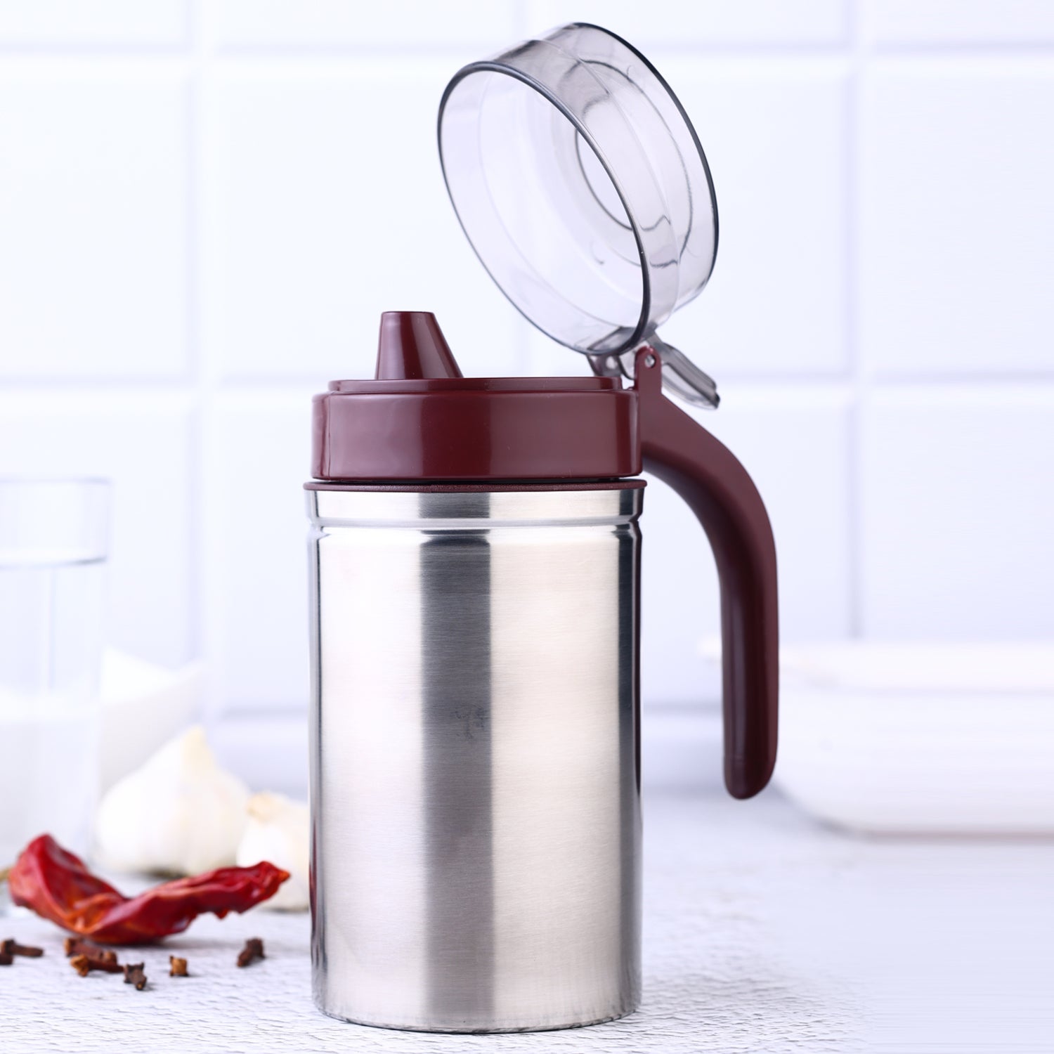 Close-up of the anti-drip small nozzle on the stainless steel oil pourer.