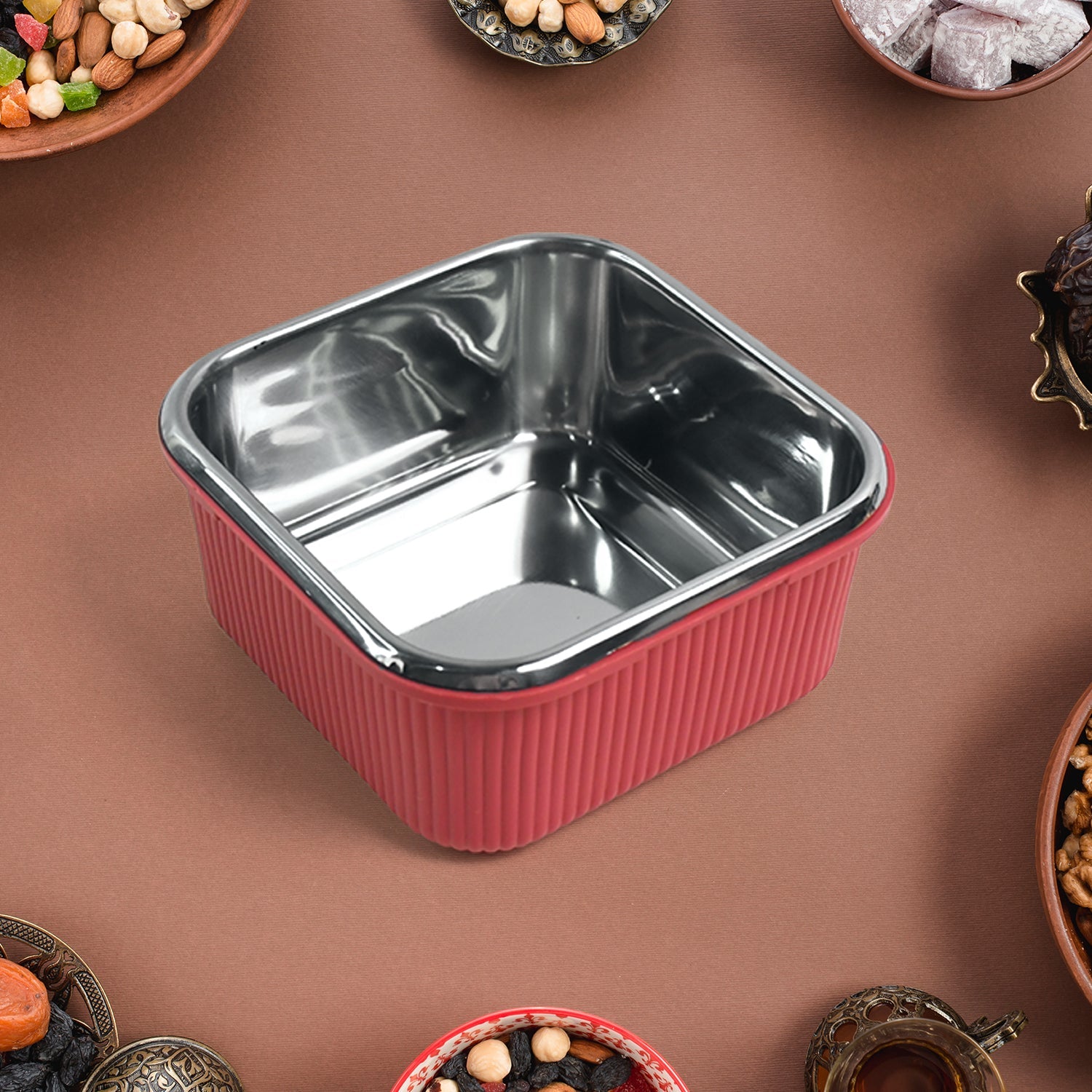 Side view showing four-sided locking lid on stainless steel container