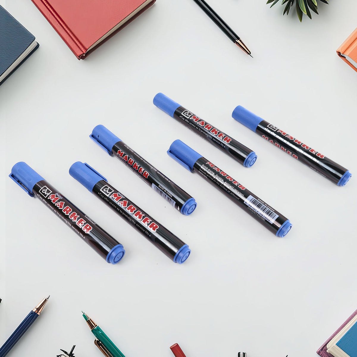 Set of premium permanent blue marker pens arranged side by side