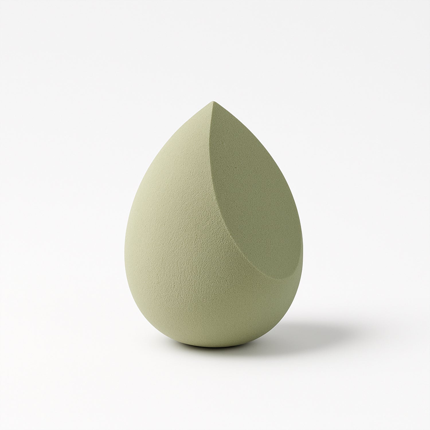 Demonstrating the soft, flexible texture and elasticity of the BeautyBare makeup sponge.