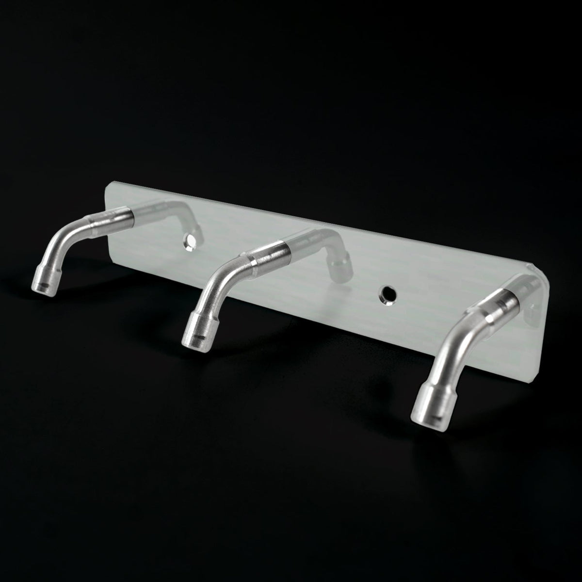 Stainless steel coat hook rack holding towels and bags