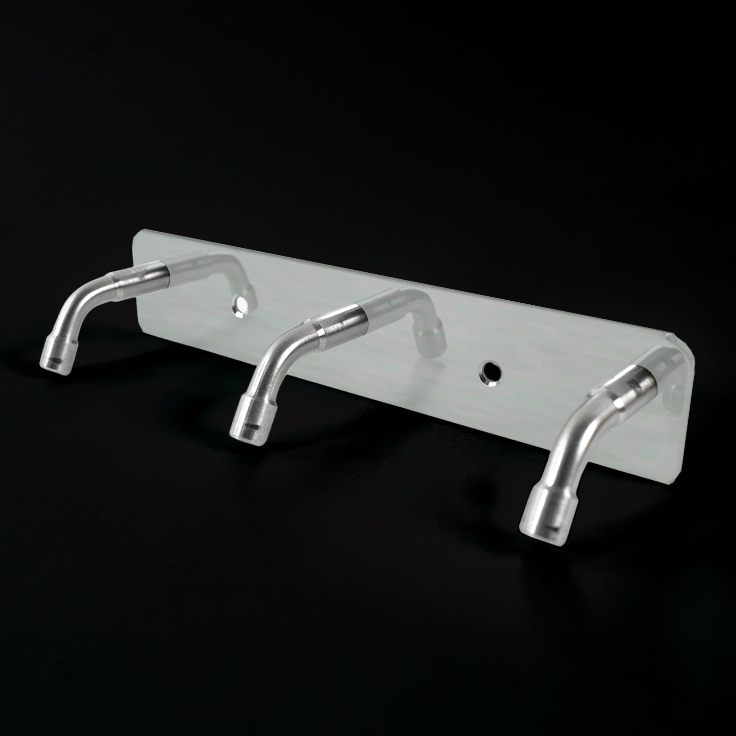 Stainless steel coat hook rack holding towels and bags
