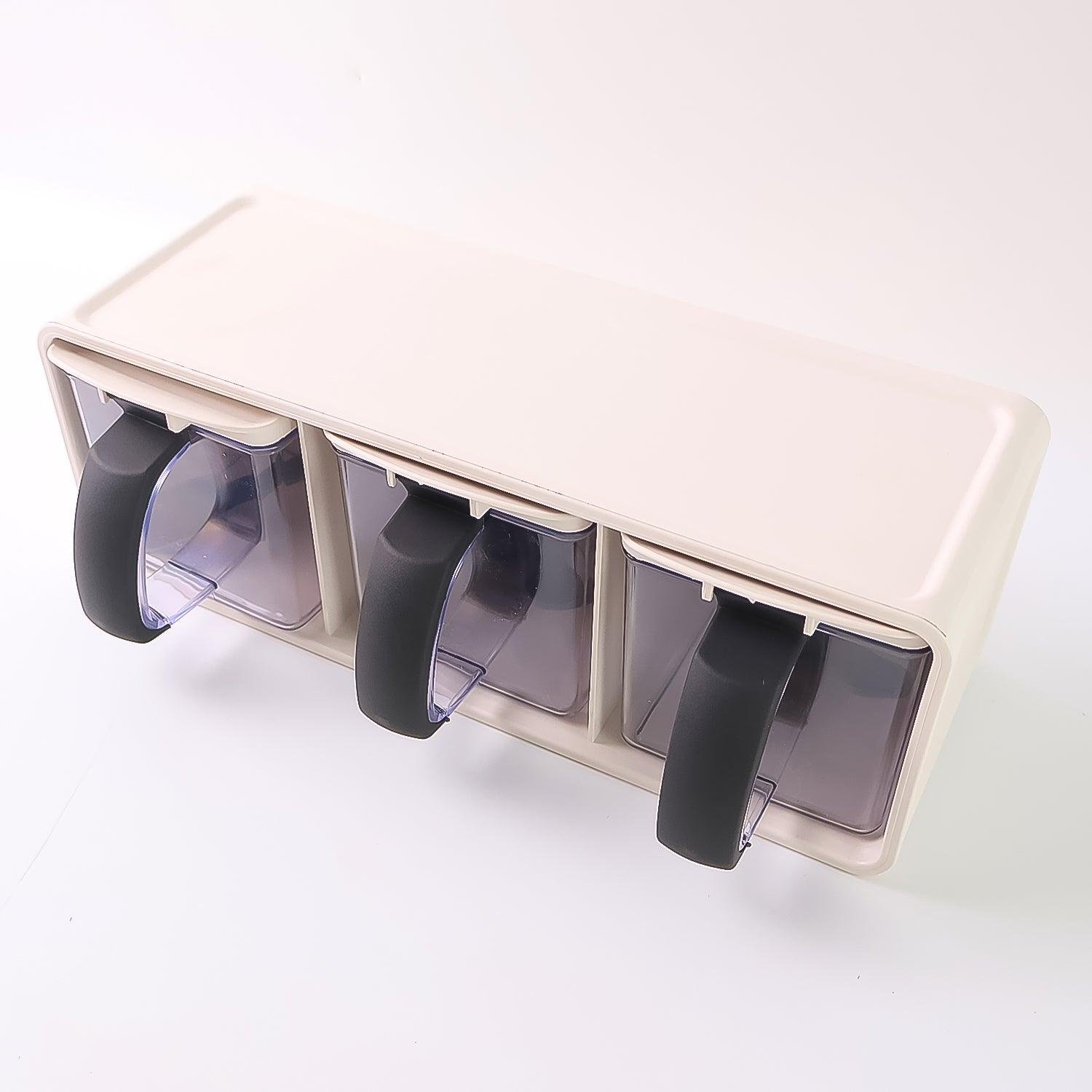 Spice storage containers with ergonomic black handles in Grinss modular box set