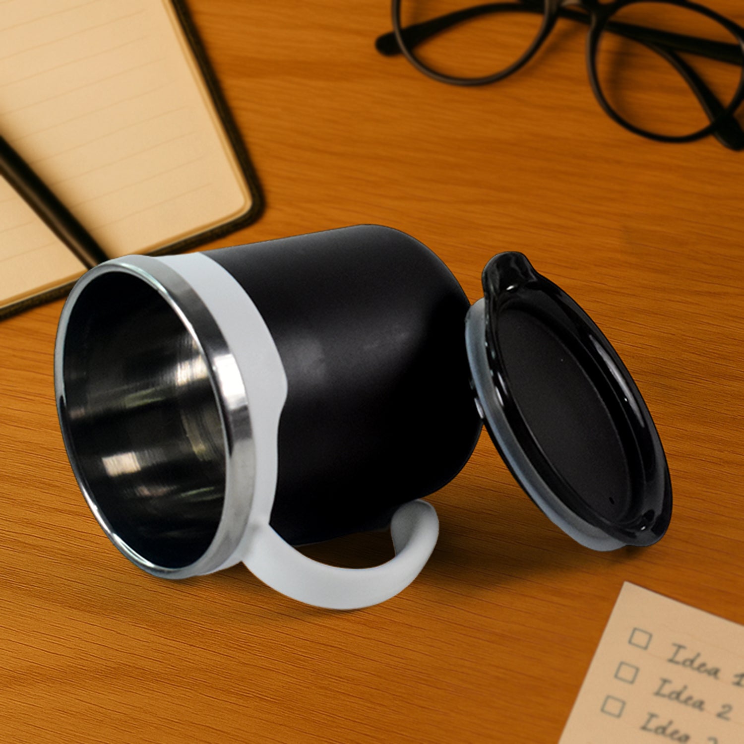 Pair of mocha coffee mugs showcasing their matte black finish and white handles.