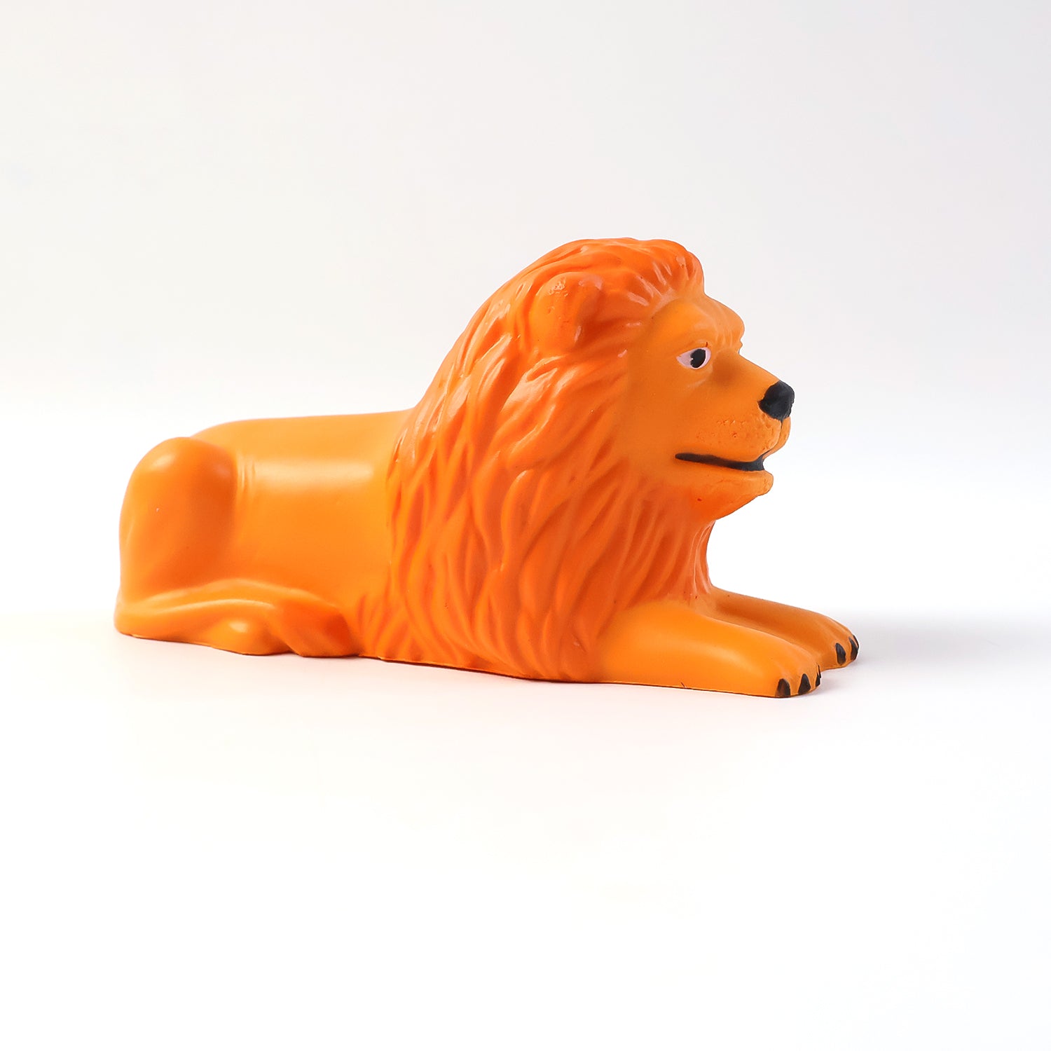 Compact lion dashboard toy in a resting lion pose, perfect car accessory