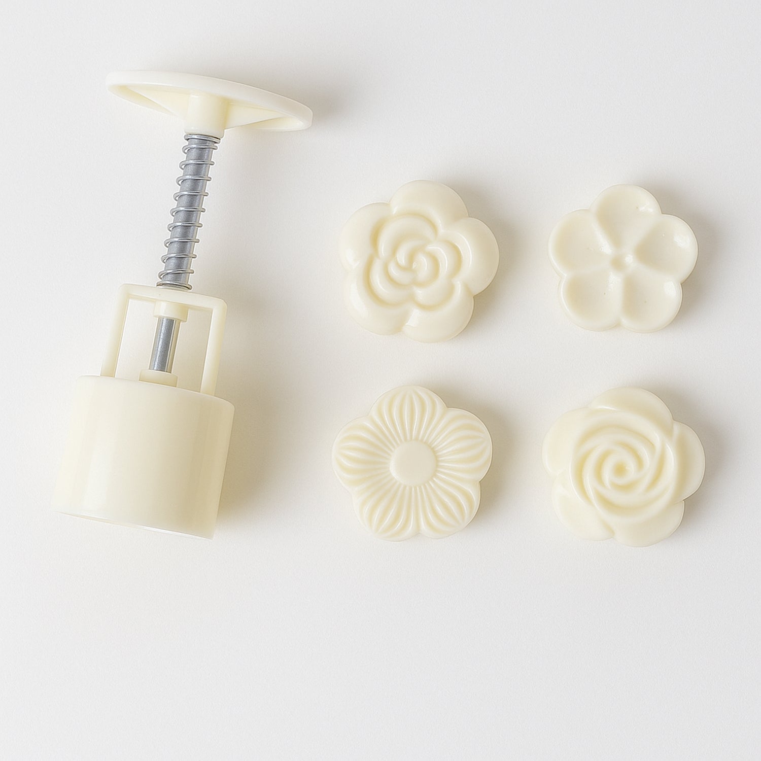 Mooncake press mold demonstrating floral pattern creation with spring press