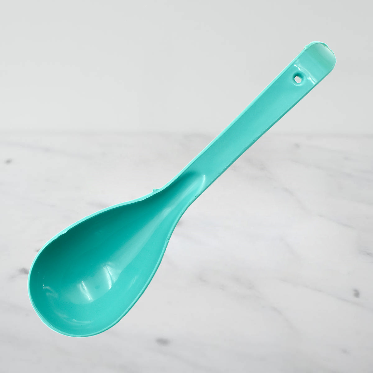 Collection of heat-resistant plastic serving spoons neatly arranged, ready for diverse culinary needs.