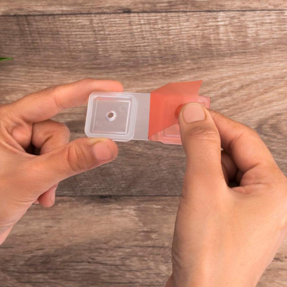 Wall-mounted dry food dispenser filled with cereals, illustrating its transparency and ease of use.