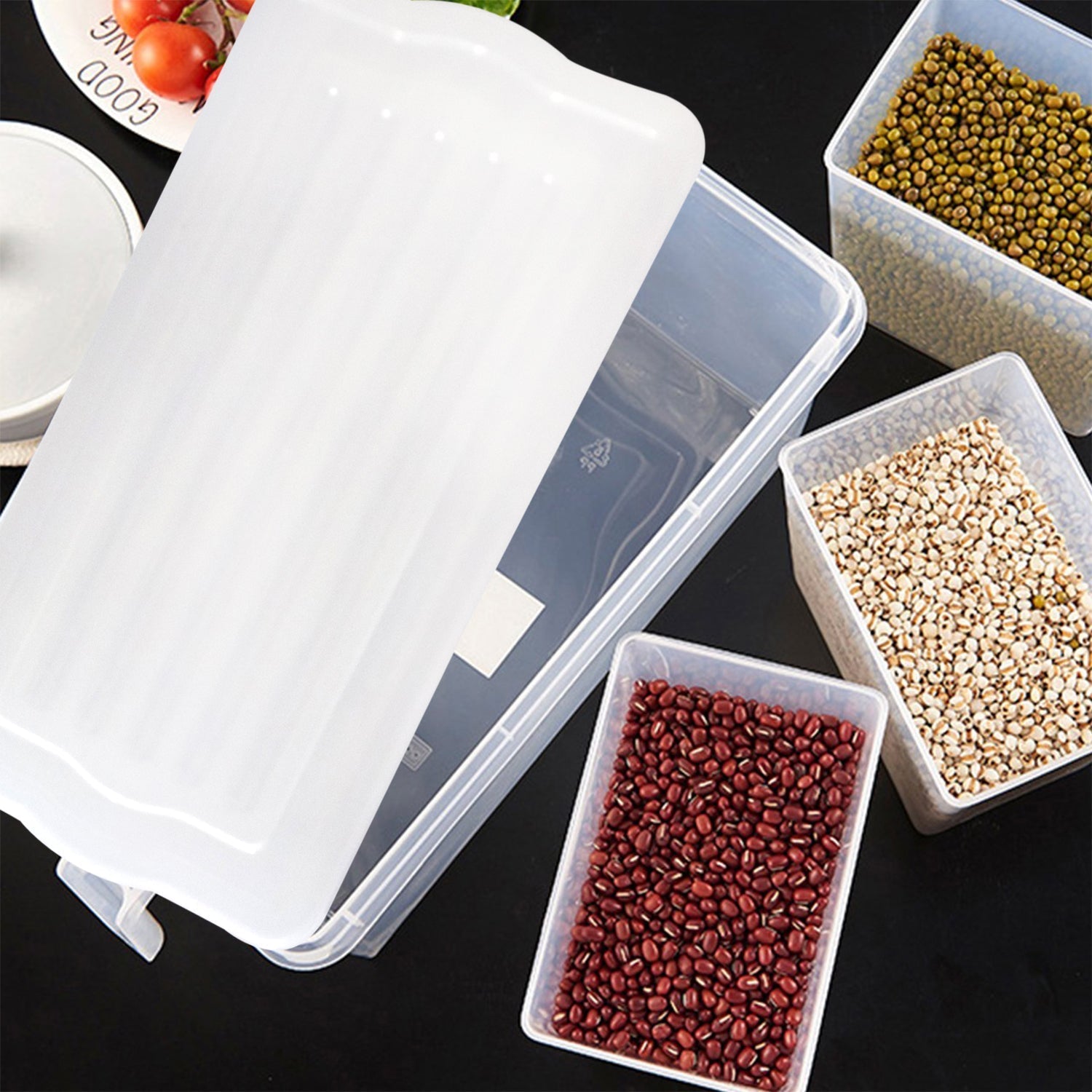 Transparent kitchen storage box filled with fresh produce for easy viewing.