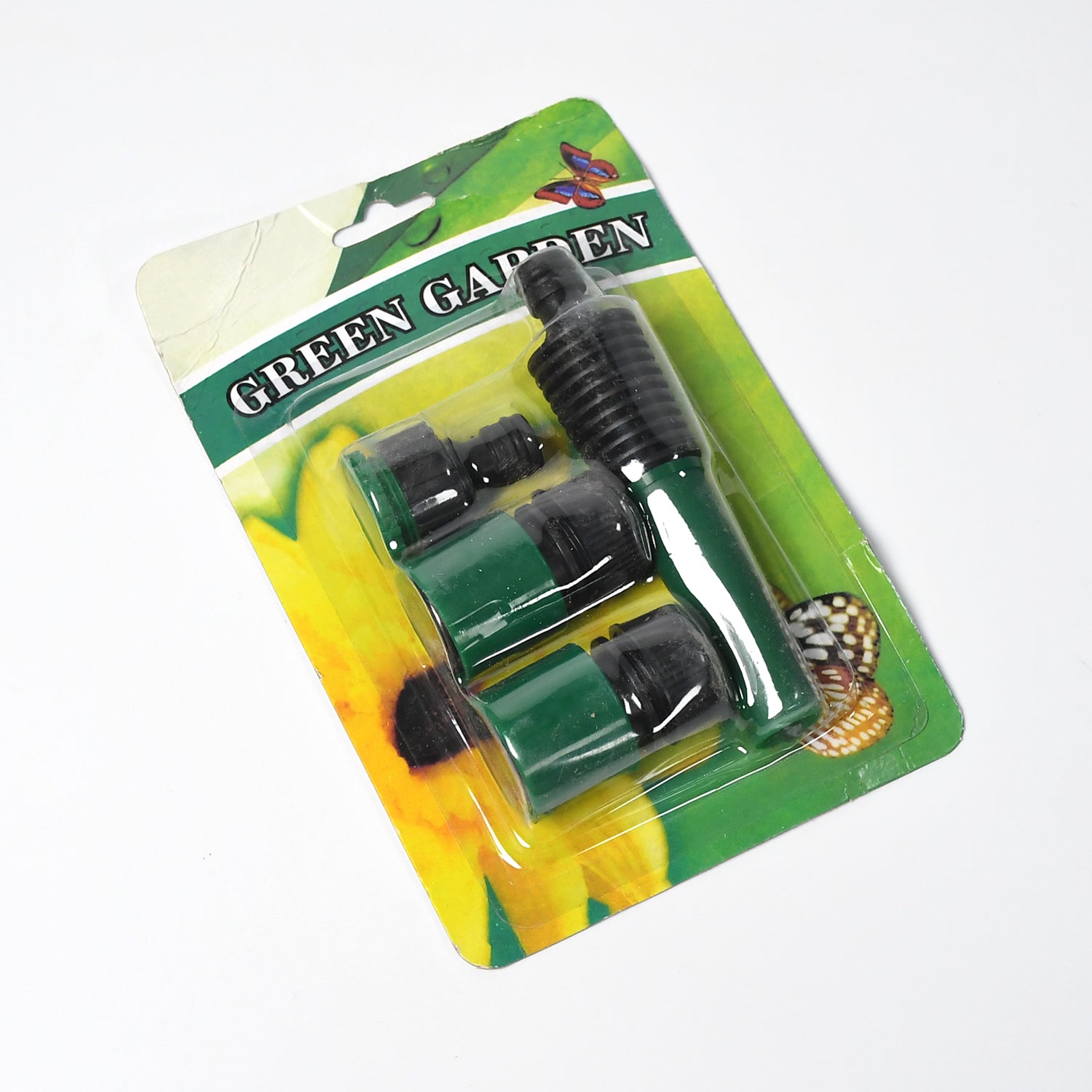 All components of the garden hose nozzle and connector set arranged neatly.