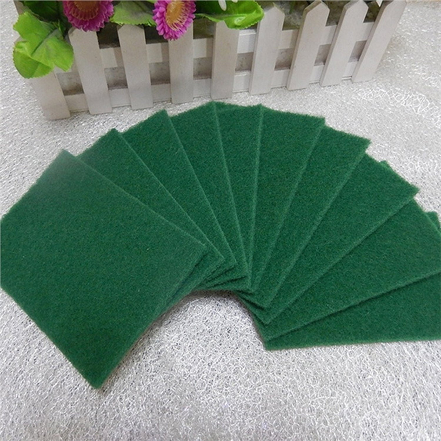 Set of 10 aqua green cleaning pads, ideal for tough stain removal.