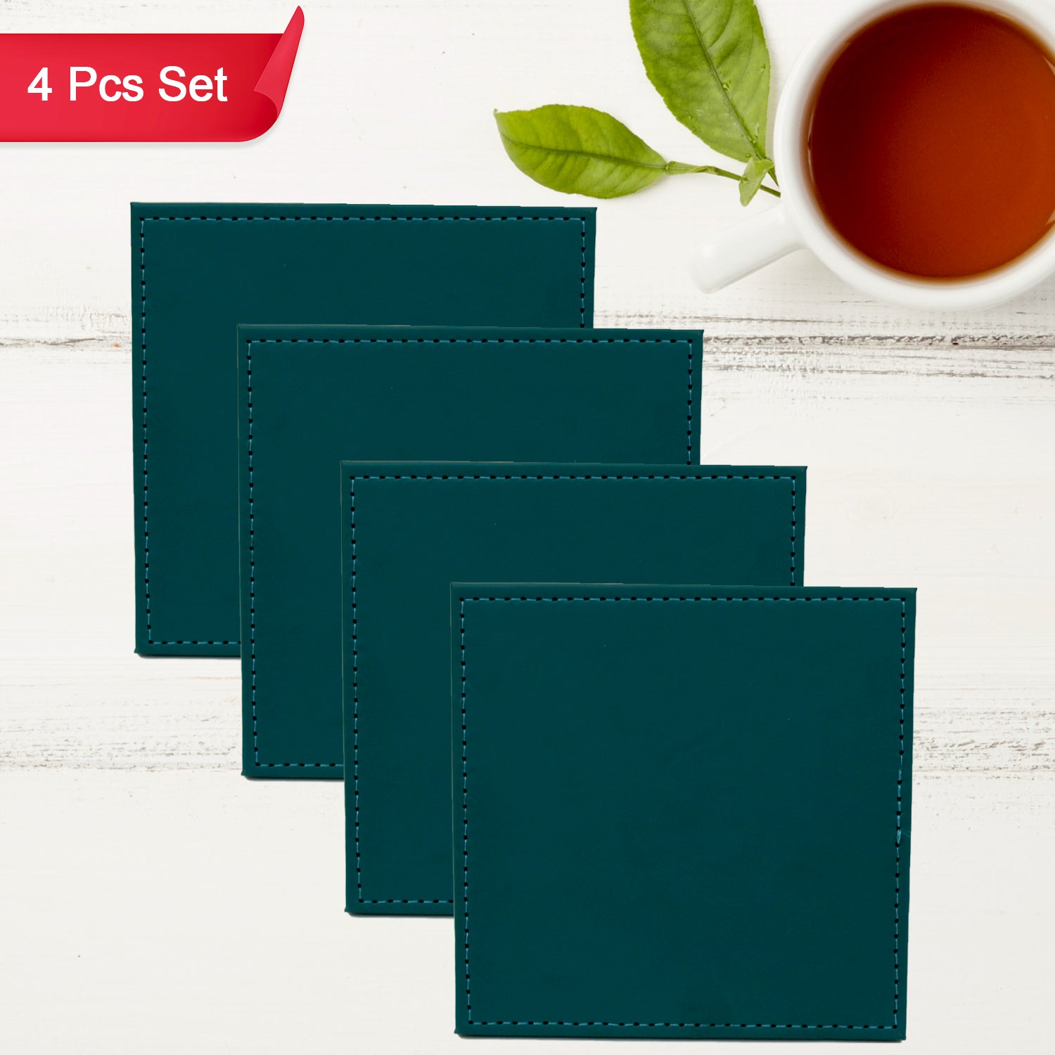 Stylish leather square coasters stacked, with one placed beside a small plant, enhancing home decor.