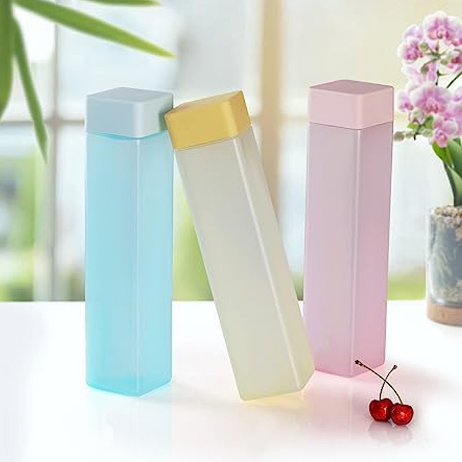 Vibrant assortment of BPA-free plastic water bottles, each with a convenient carry strap.