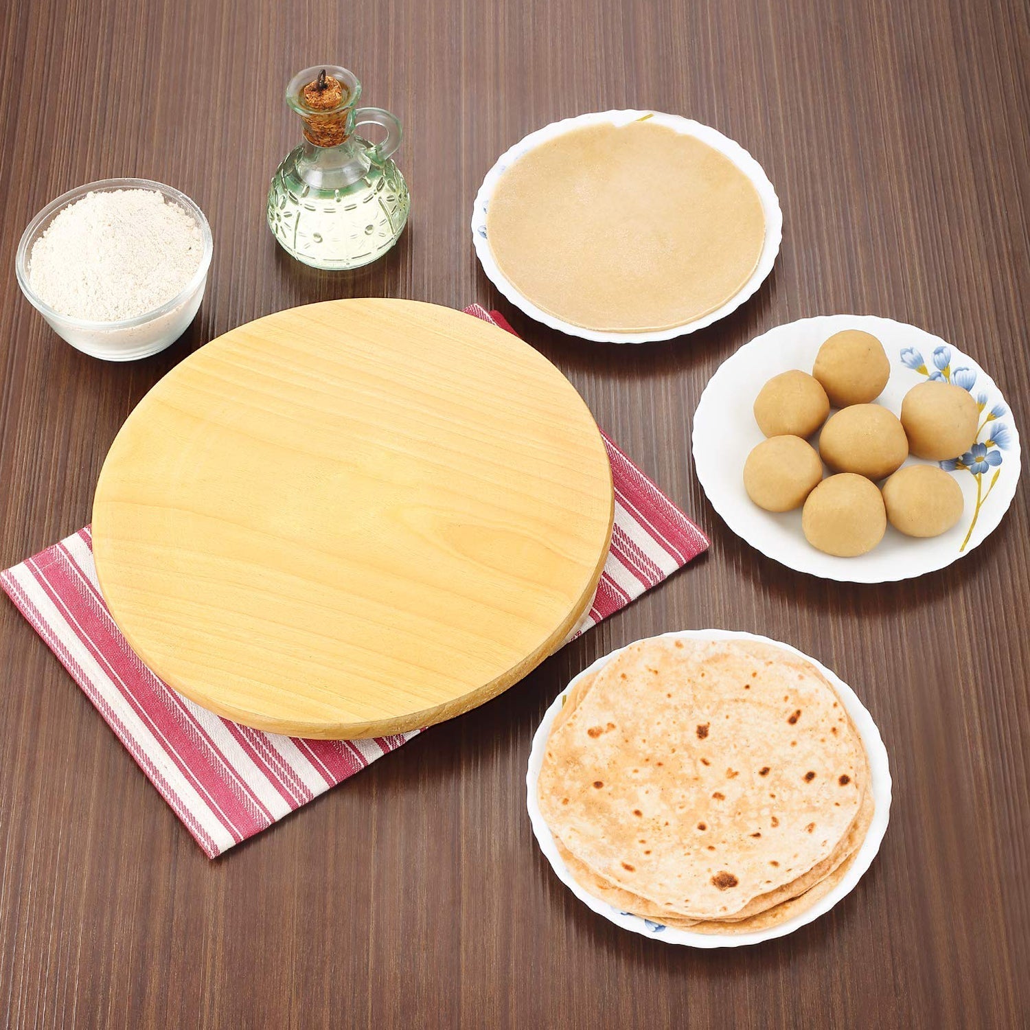 Compact electric roti maker on a kitchen counter, ready for use.