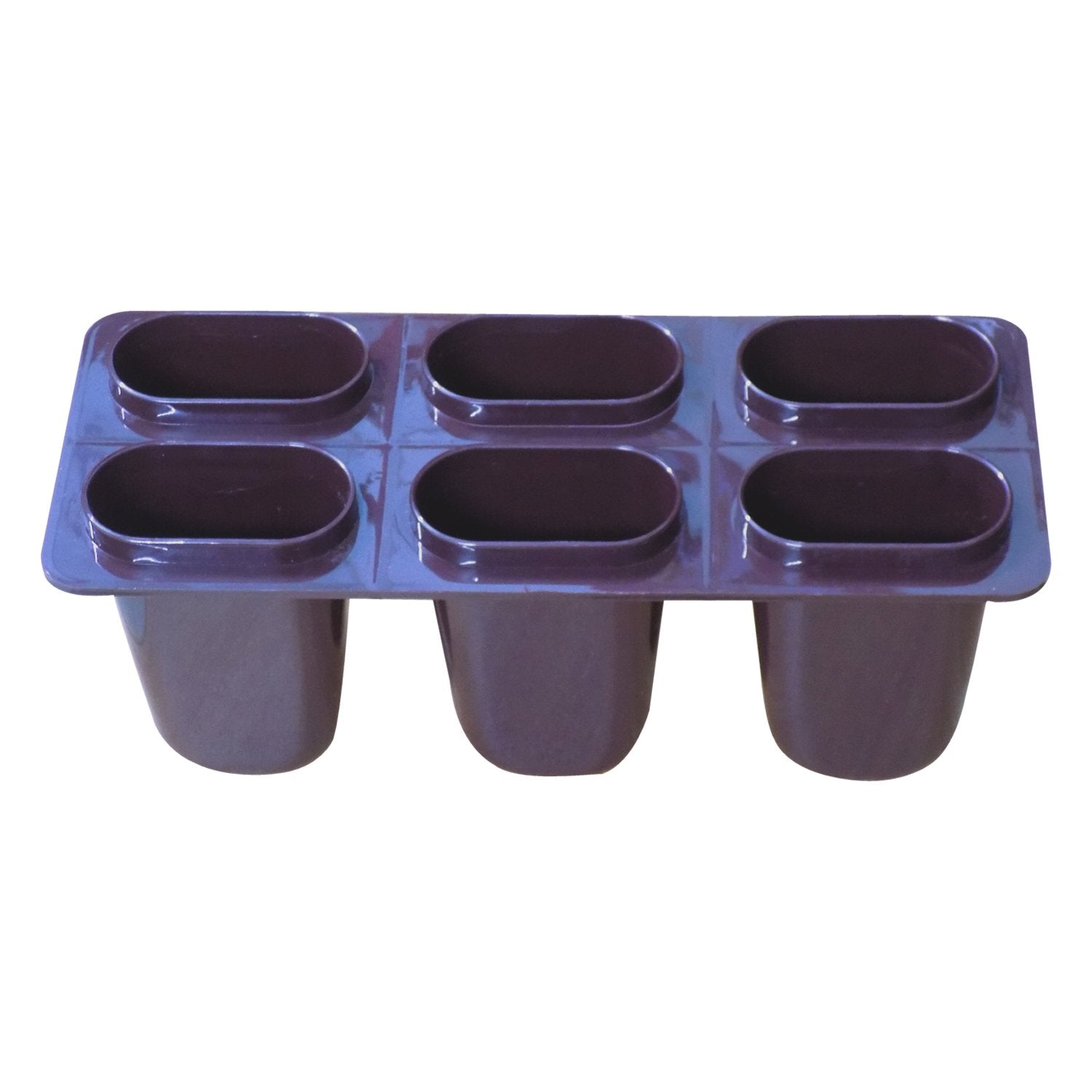 Hand holding a filled Kulfi Maker mold, demonstrating its ease of use.