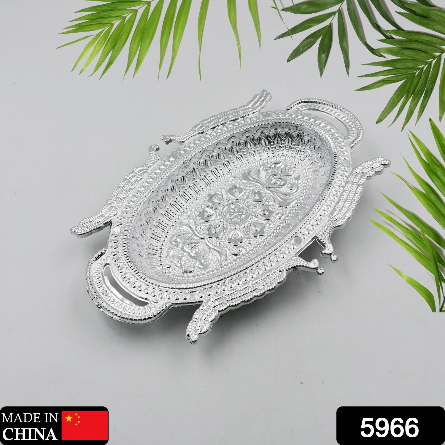 Traditional Mukhwas and dry fruit serving tray featuring a detailed, ornate border.