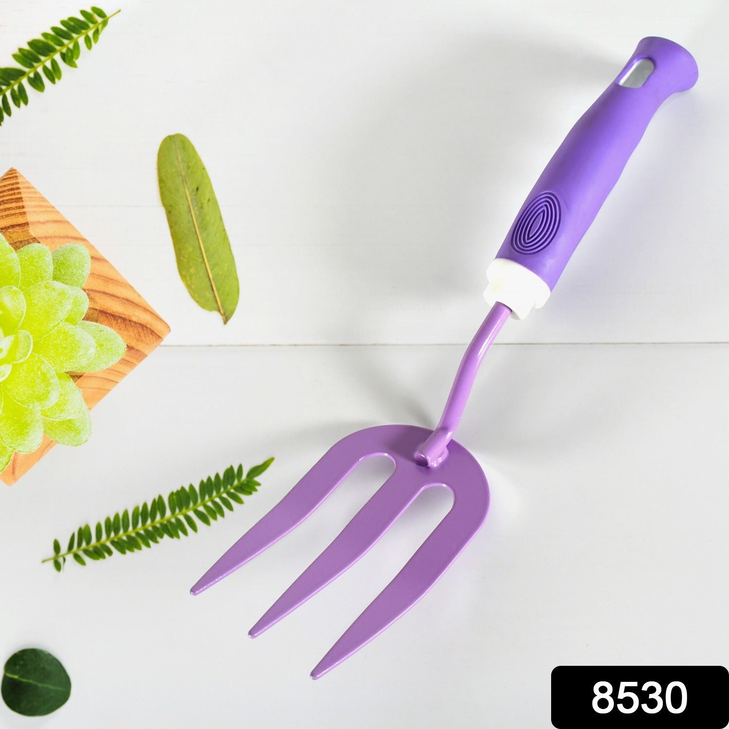 Sturdy metal cultivator from the garden tool kit for aerating soil.