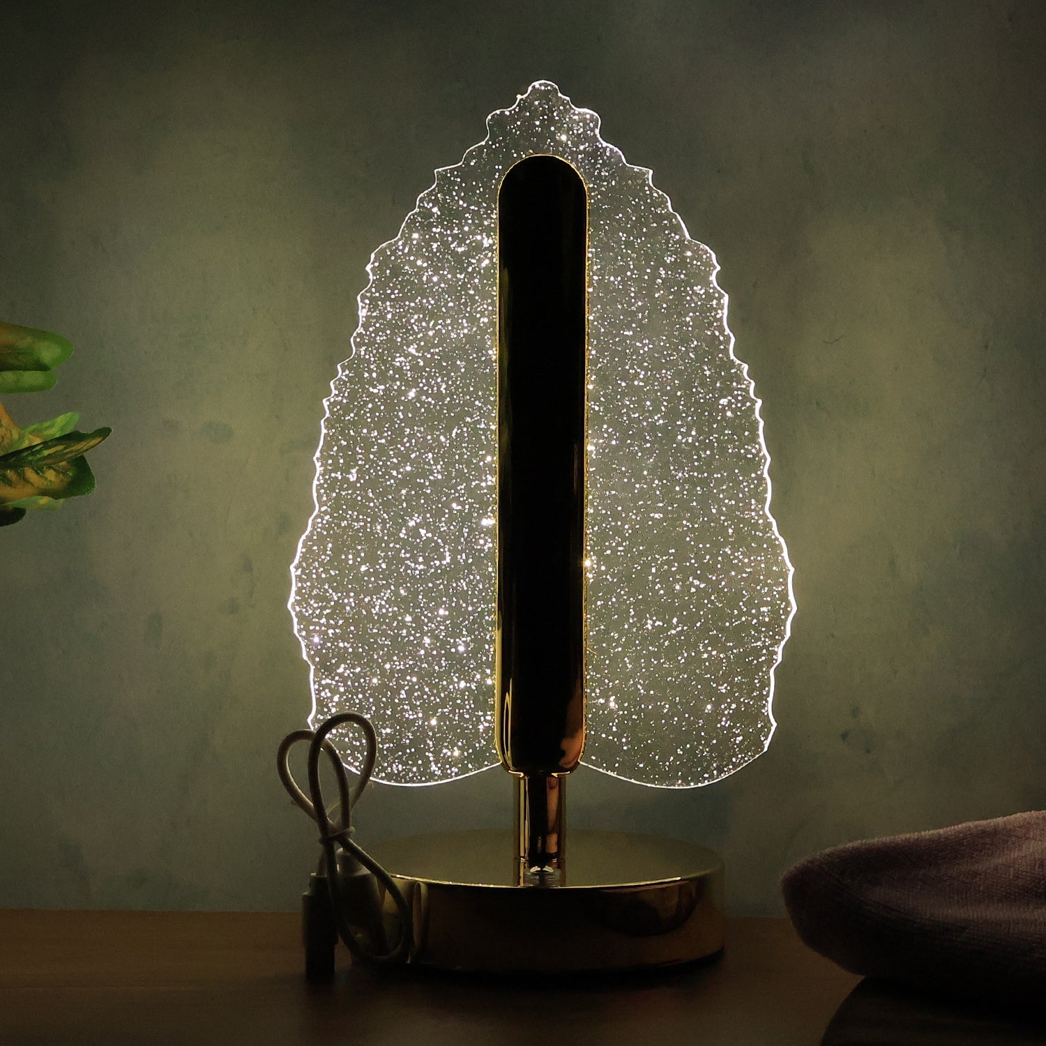 Decorative LED table lamp casting unique reflections with USB power feature