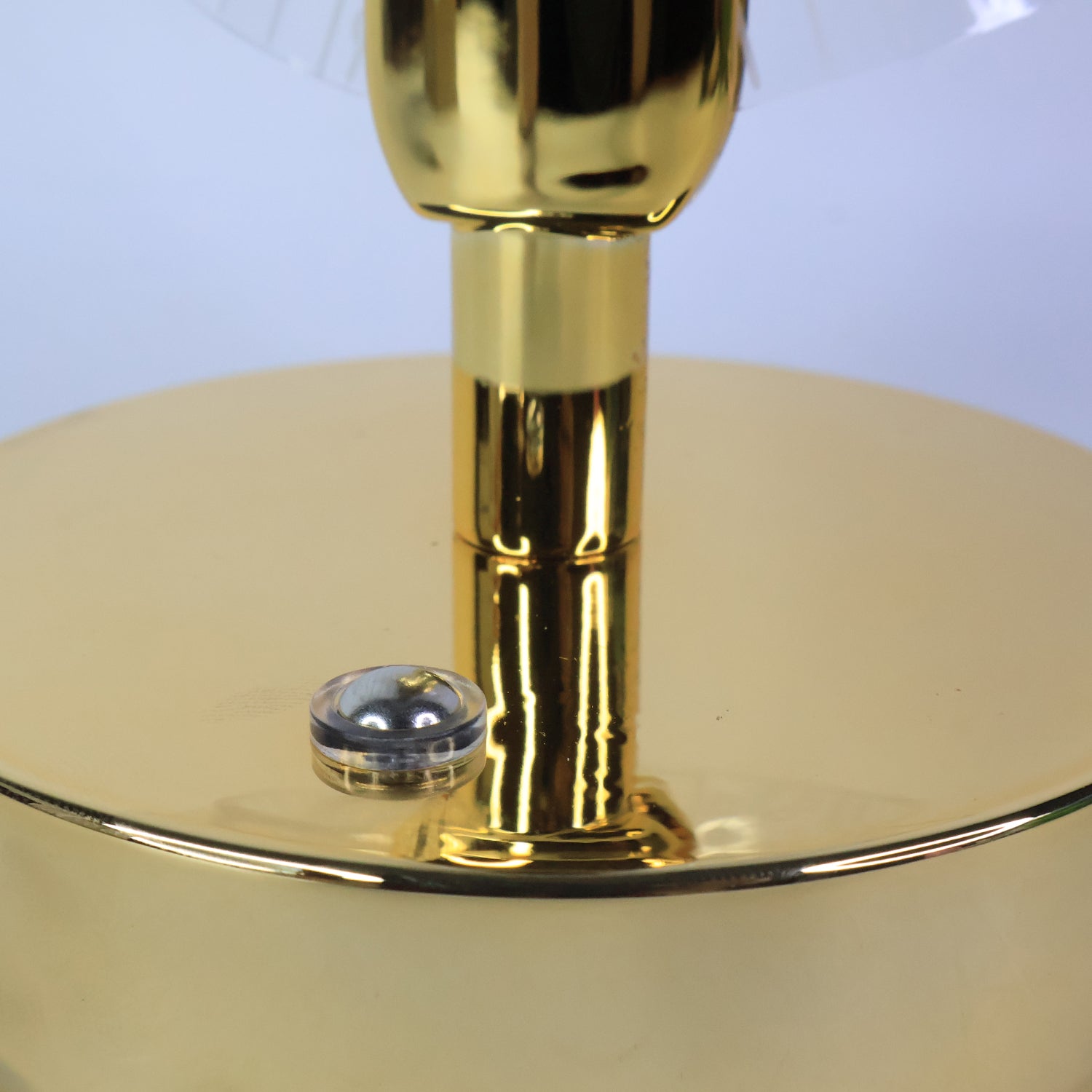 Elegant table lamp showing golden base and crystal acrylic shades